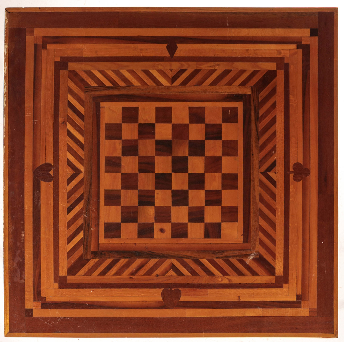 A FOLKY INLAID MARQUETRY TABLE WITH GAME BOARD TOP