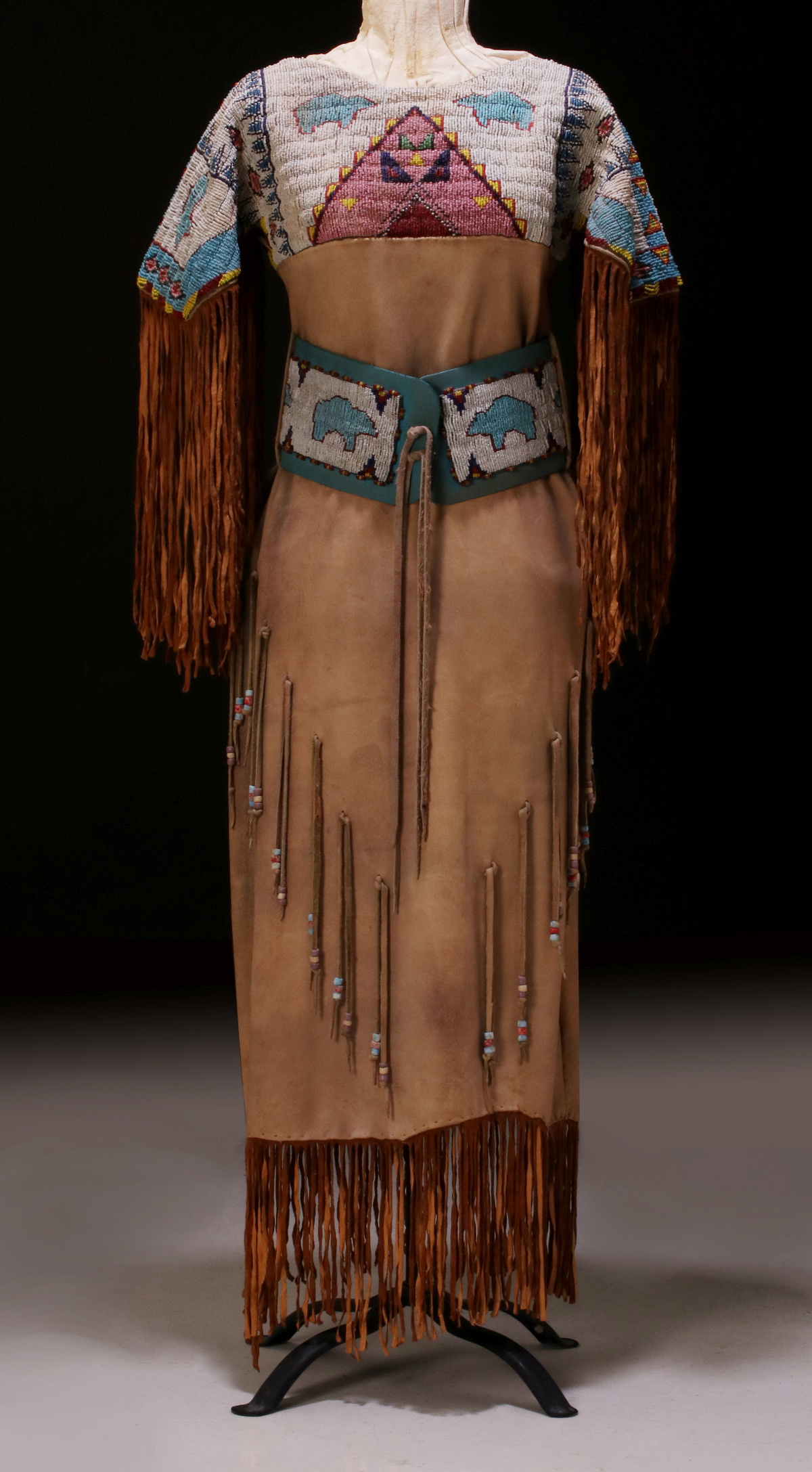A LAKOTA SIOUX BEADED HIDE DRESS BY CHARLES FAST HORSE