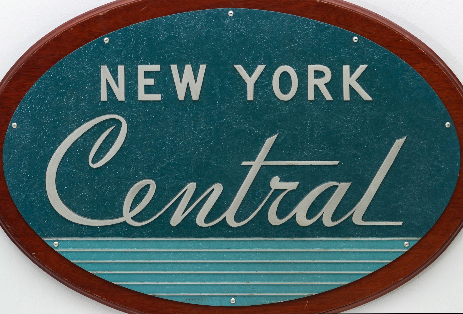 A MID 20TH CENTURY NEW YORK CENTRAL ADVERTISING PLAQUE