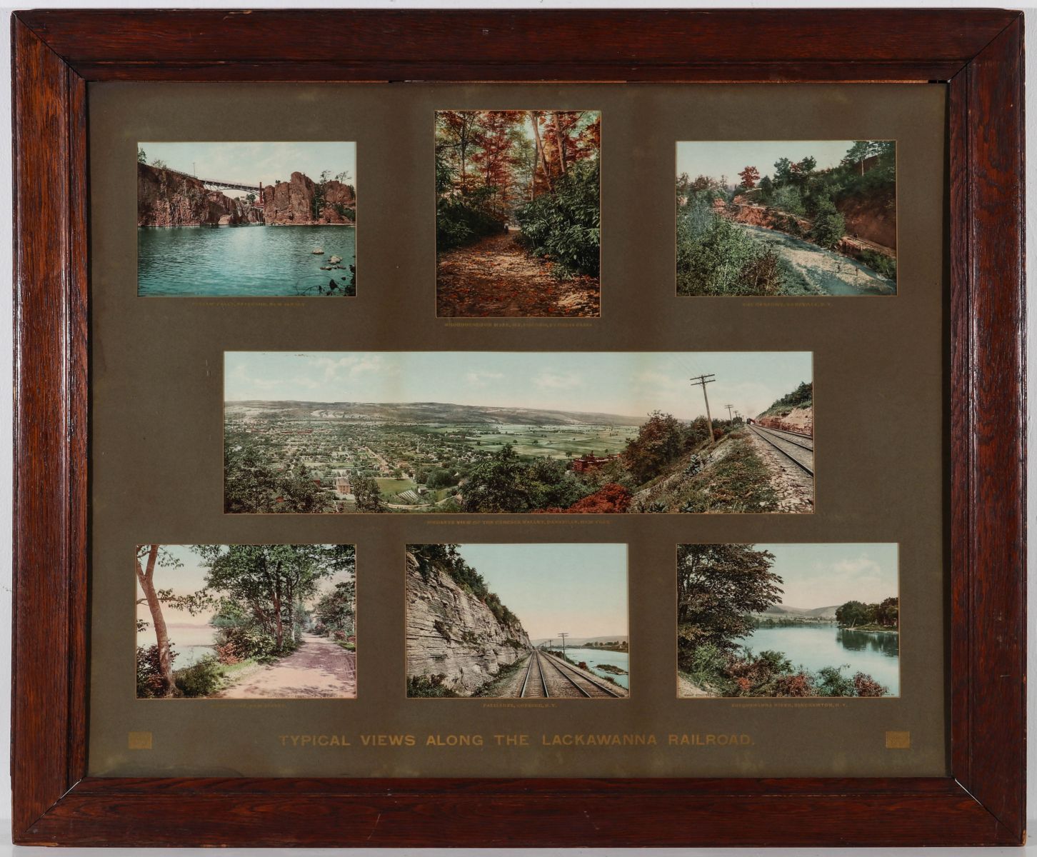 A FRAMED SUITE OF SEVEN VIEWS ON THE LACKAWANNA RR 1902