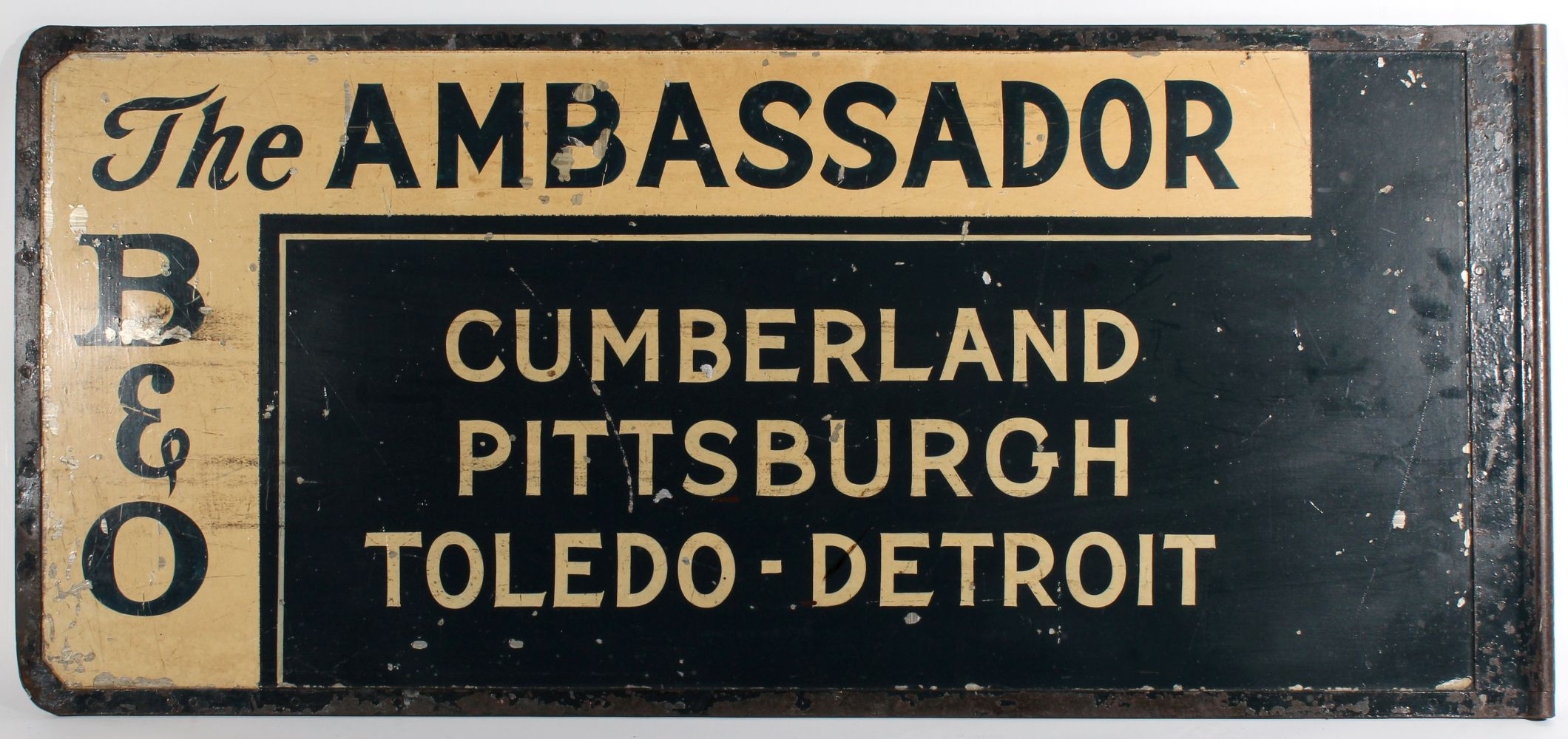A PAINTED STEEL GATE SIGN FOR THE AMBASSADOR ON B&O RR