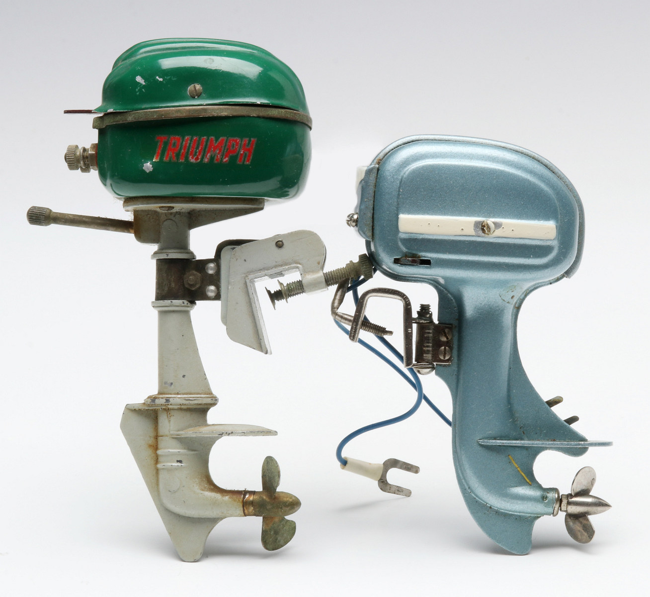 A TRIUMPH BRAND TOY OUTBOARD MOTOR, PLUS ANOTHER