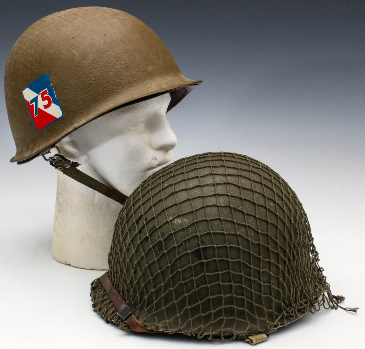 TWO WWII SURVIVAL BALE HELMETS WITH LINERS