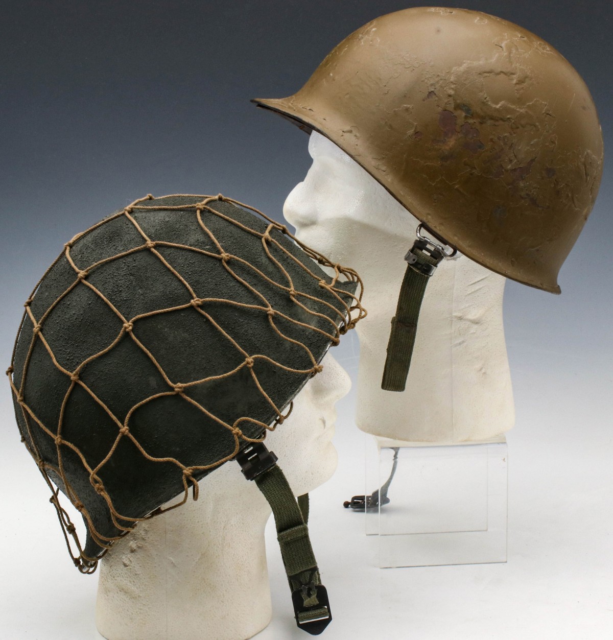 TWO US WWII BALE HELMETS, ONE 4TH DIVISION WITH LINER