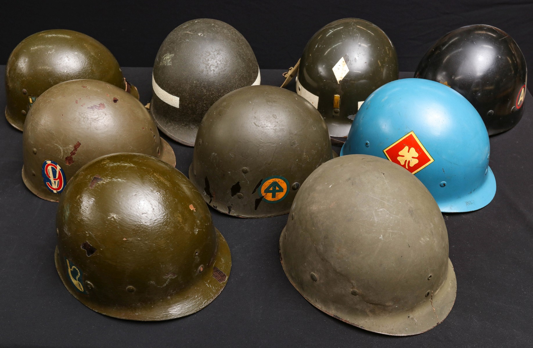 A COLLECTION OF NINE GOOD US MILITARY HELMET LINERS