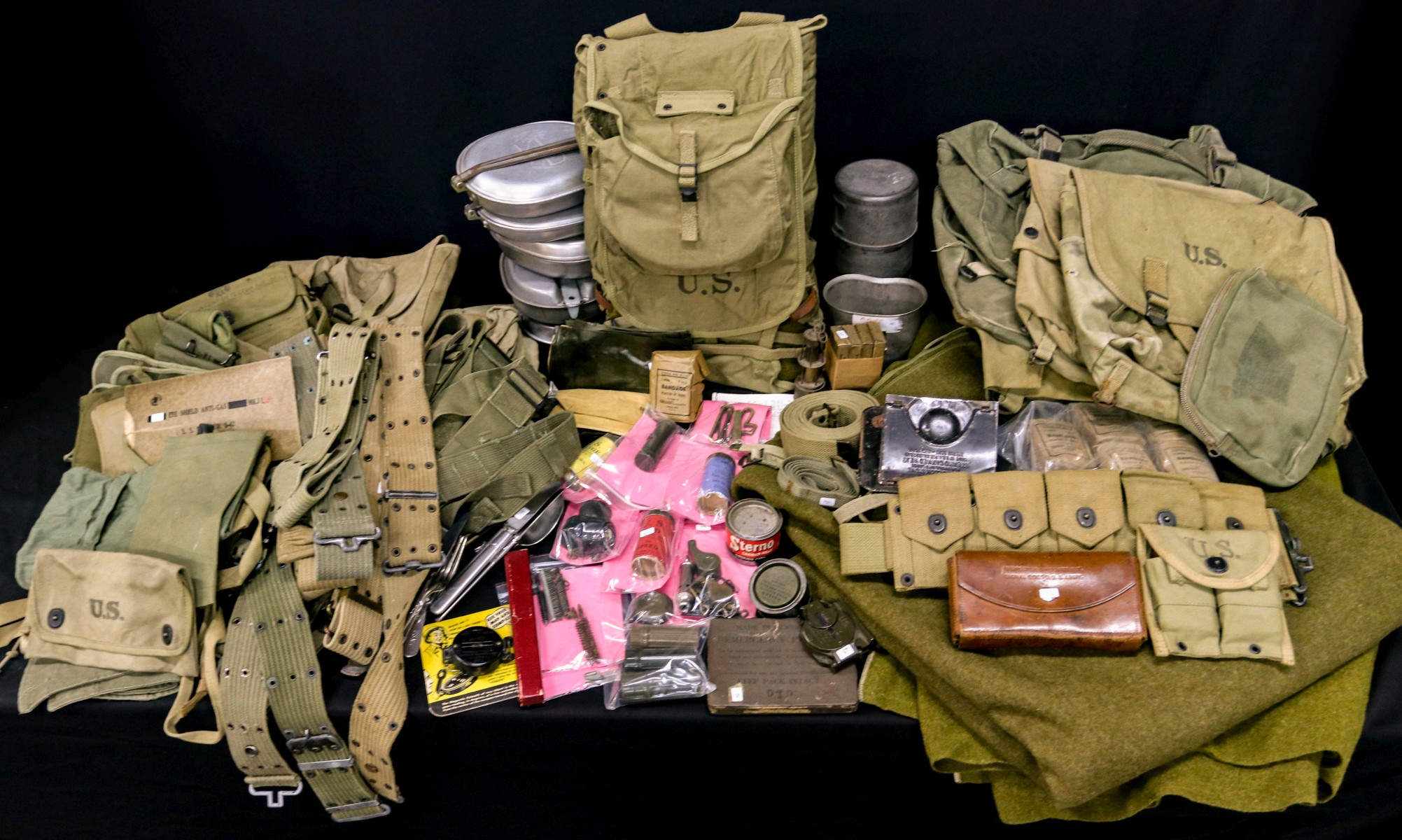 A LARGE LOT OF US WEB GEAR, MESS, AMMO POUCHES AND MORE