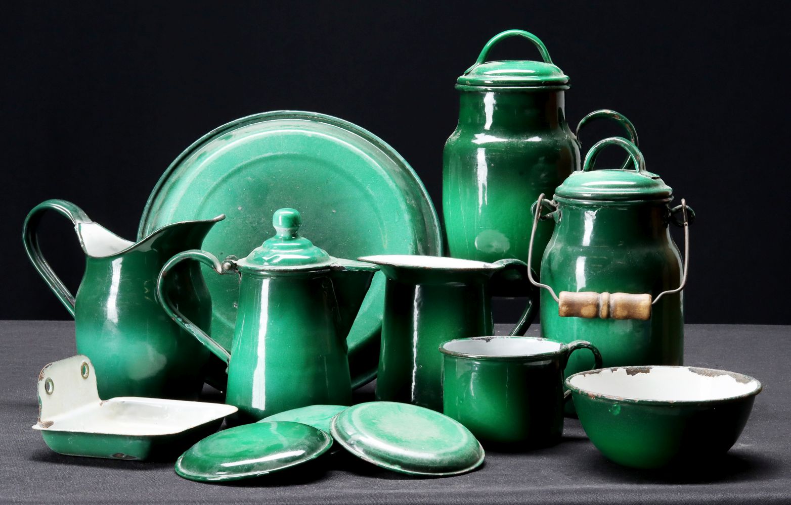 A COLLECTION OF ANTIQUE GREEN GRANITEWARE