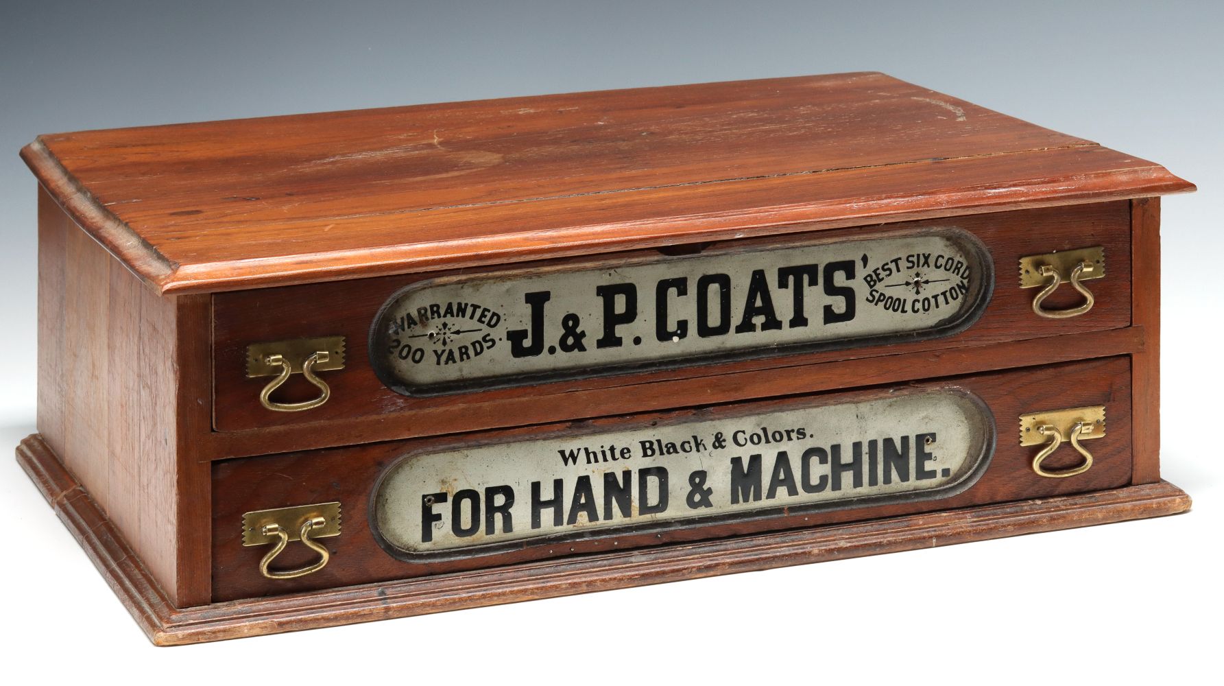 A J.&P. COATS' TWO-DRAWER ADVERTISING SPOOL CABINET