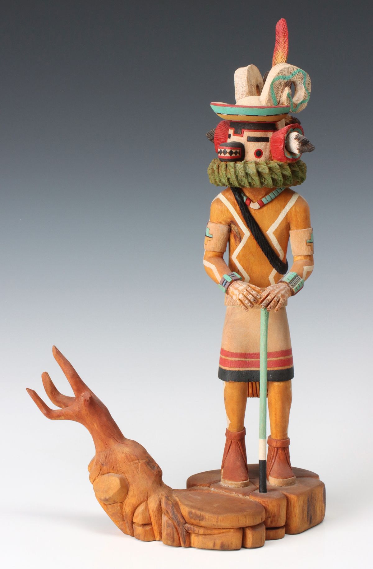 A 17-INCH CARVED WOOD RAM HEAD KACHINA SIGNED WOODY