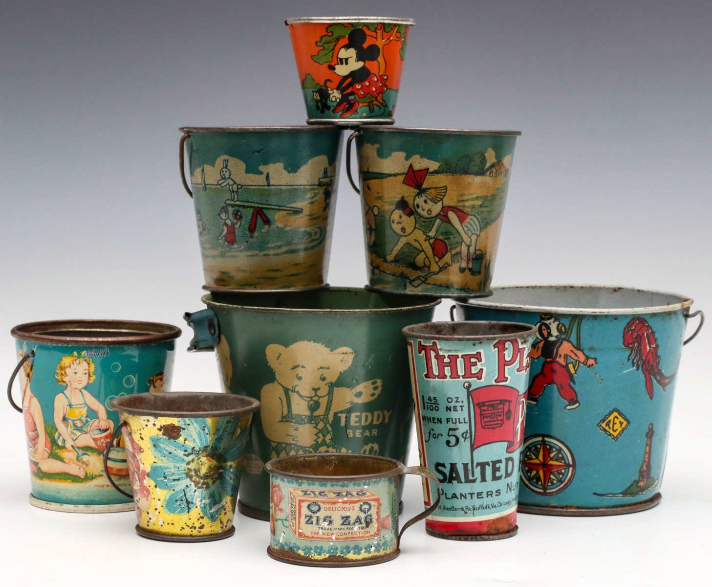 A COLLECTION OF CHILDREN'S TIN LITHO PAILS AND CUPS