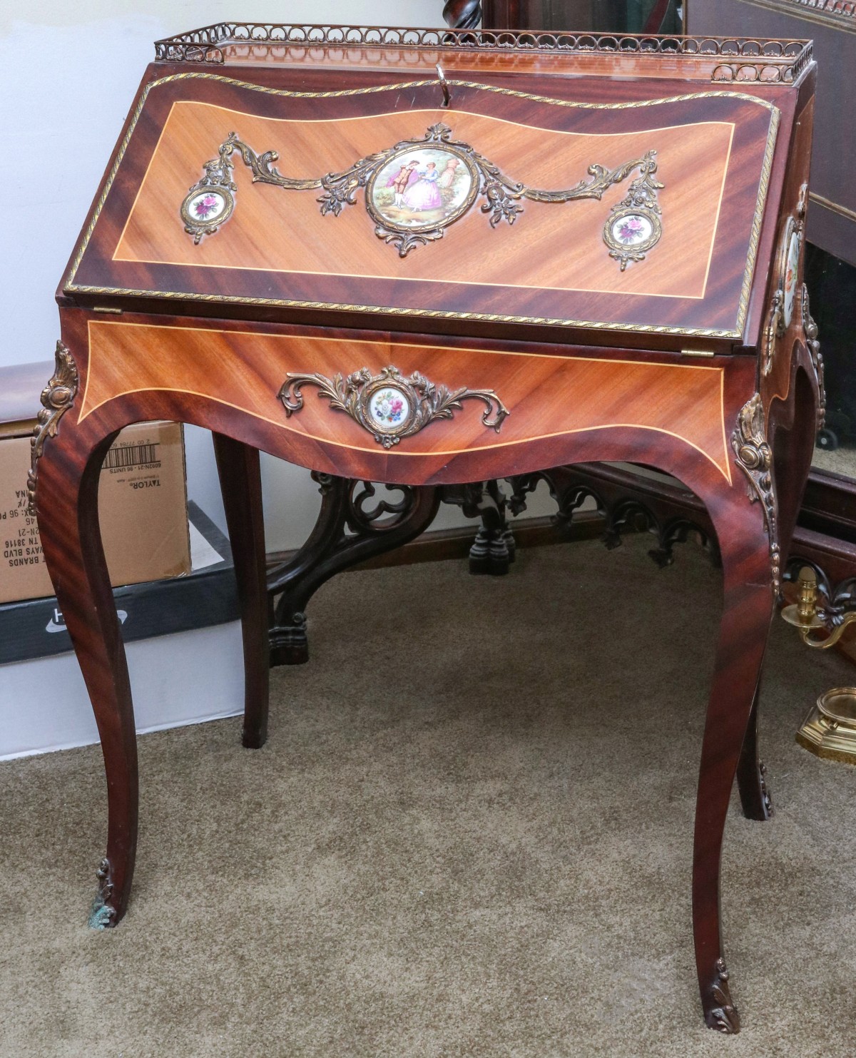 A LATE 20TH CENTURY FRENCH STYLE DESK WITH PORCELAINS