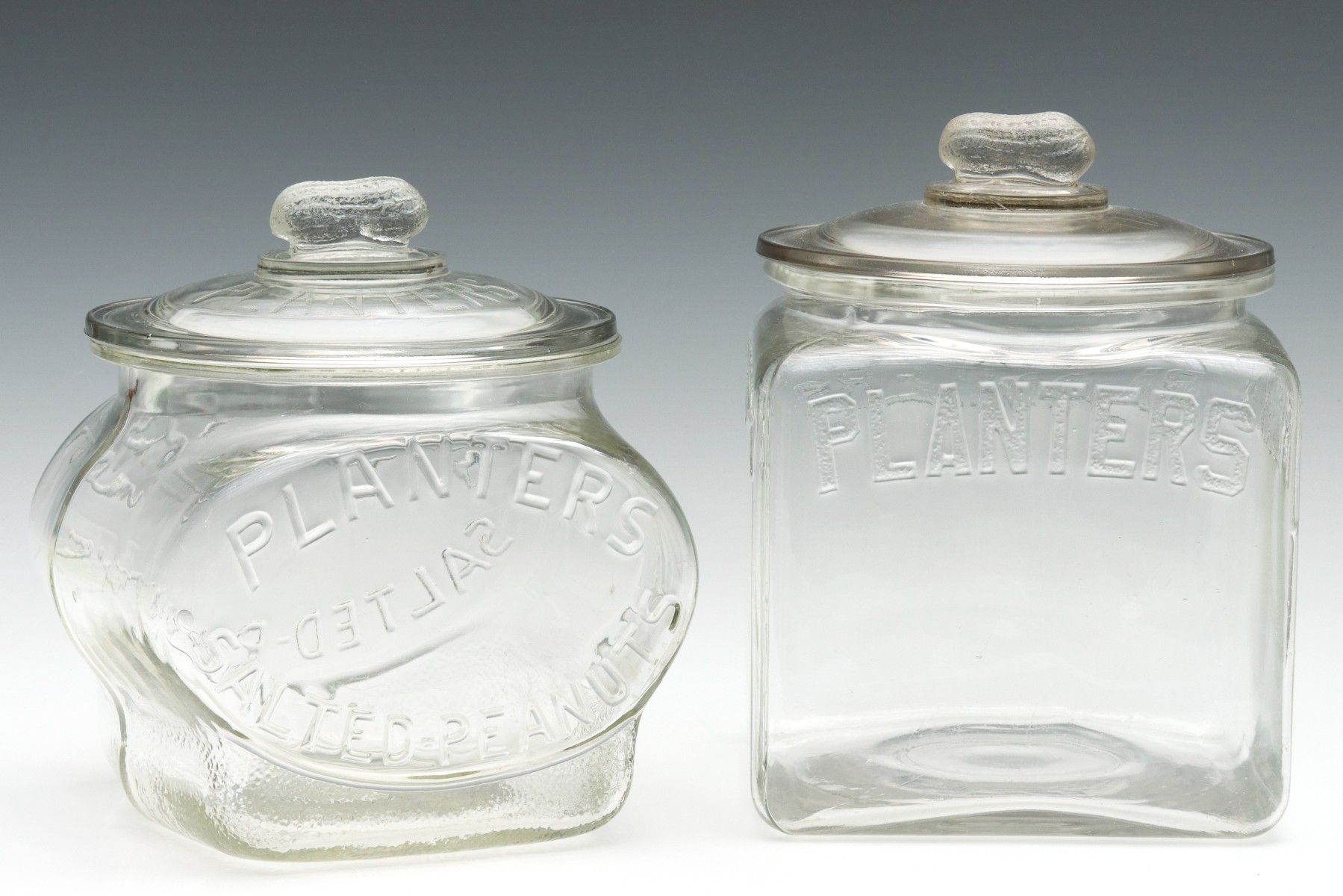 TWO DIFFERENT PLANTER'S PEANUTS ADVERTISING JARS