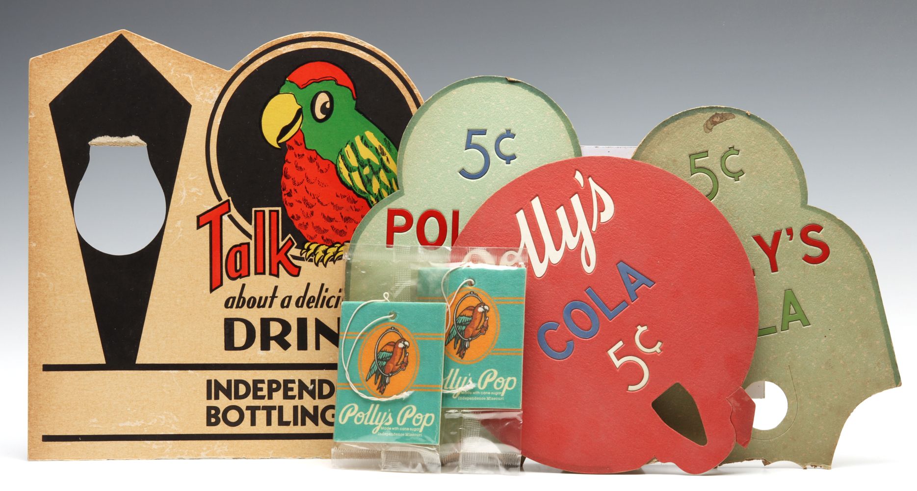 A COLLECTION OF POLLY'S POP ADVERTISING SIGNS W/ DAMAGE