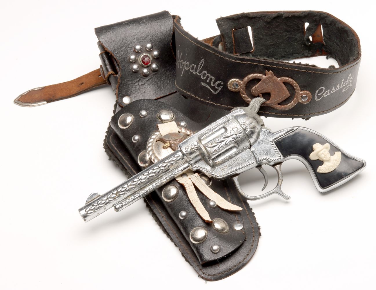 A HOPALONG CASSIDY SIX SHOOTER WITH HOLSTER