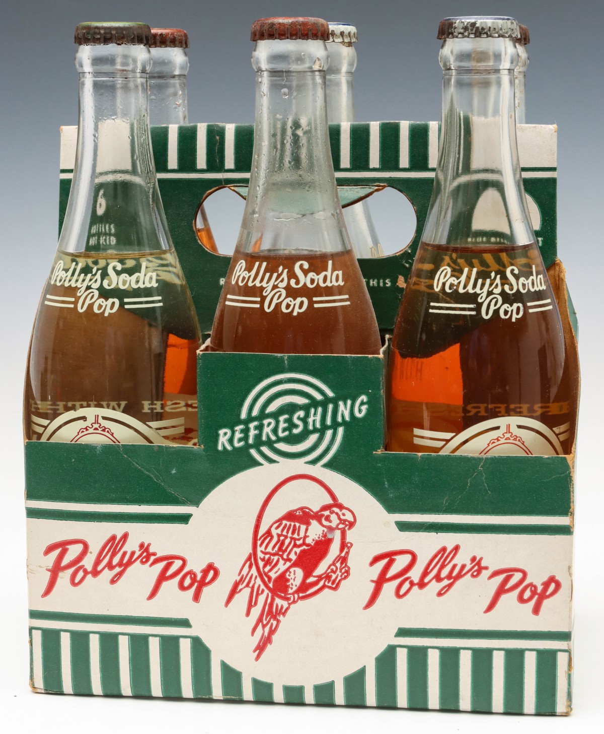 A SIX BOTTLE CARRIER WITH ORIGINAL UNOPENED POLLY'S POP