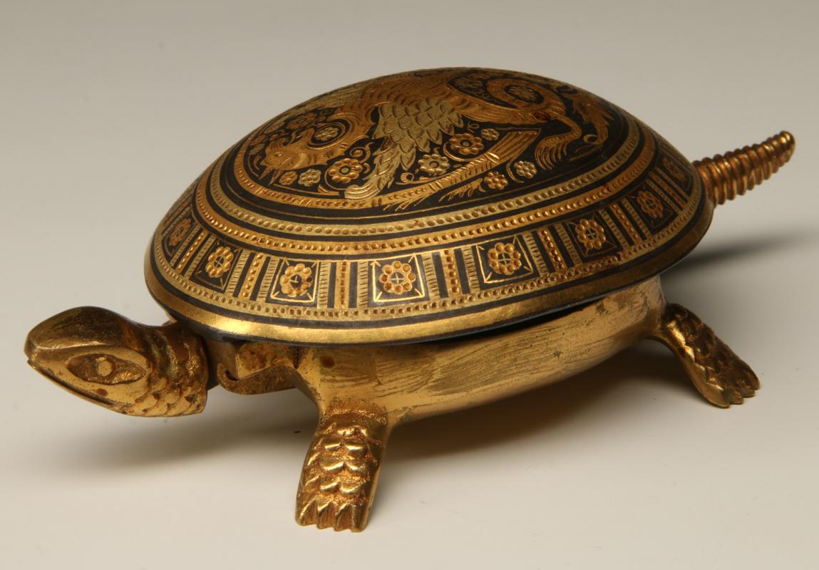 A 20TH CENTURY TURTLE FORM WIND-UP DESK BELL