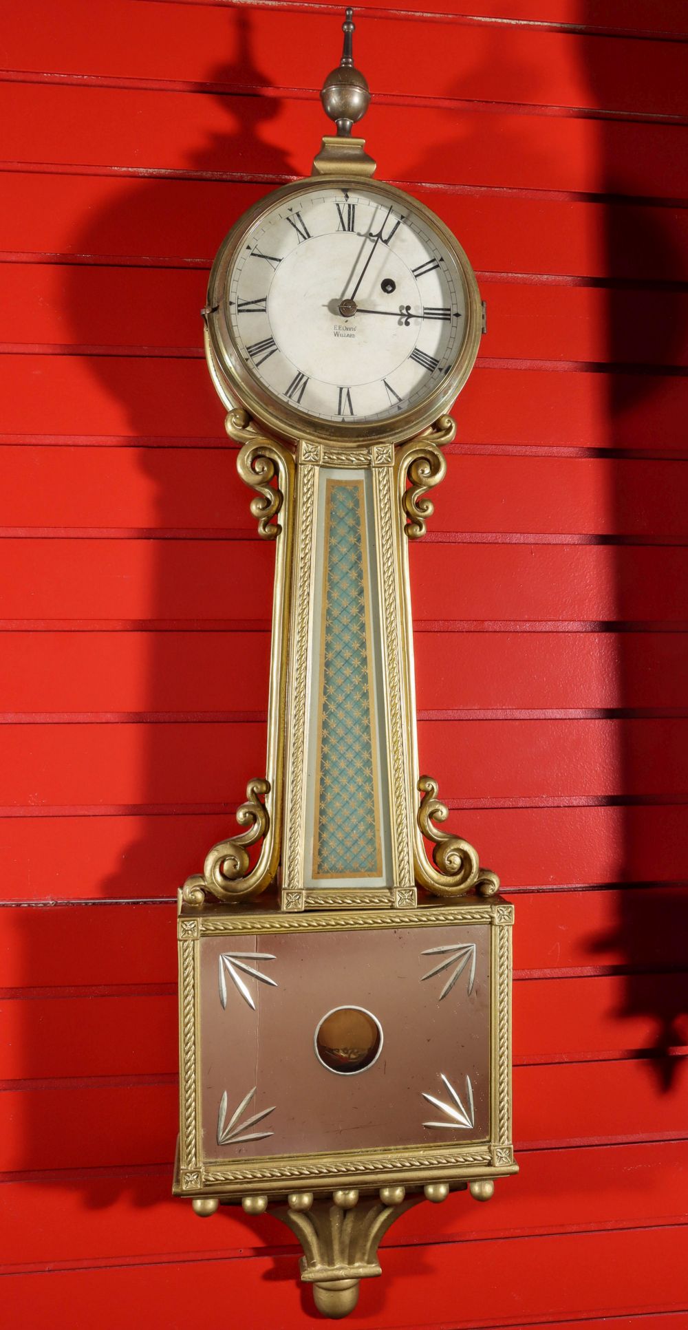 AN EARLY 20TH CENTURY BANJO CLOCK SIGNED E. E. ORVIS