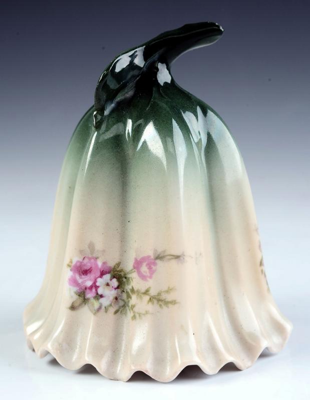 A GERMAN PORCELAIN BELL ATTRIBUTED AS BEING RS PRUSSIA