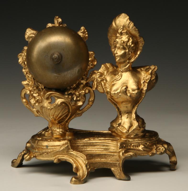 A CIRCA 1900 DESK BELL WITH FIGURAL LADY