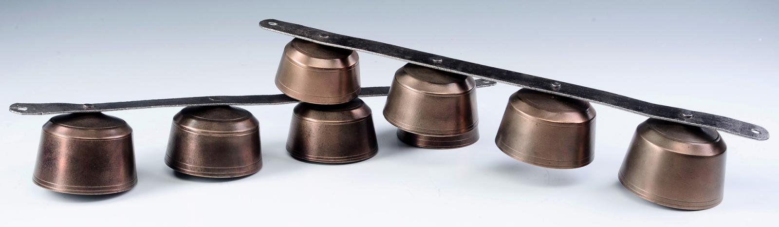 TWO SETS OF MATCHING BRASS SHAFT BELLS MOUNTED ON IRON