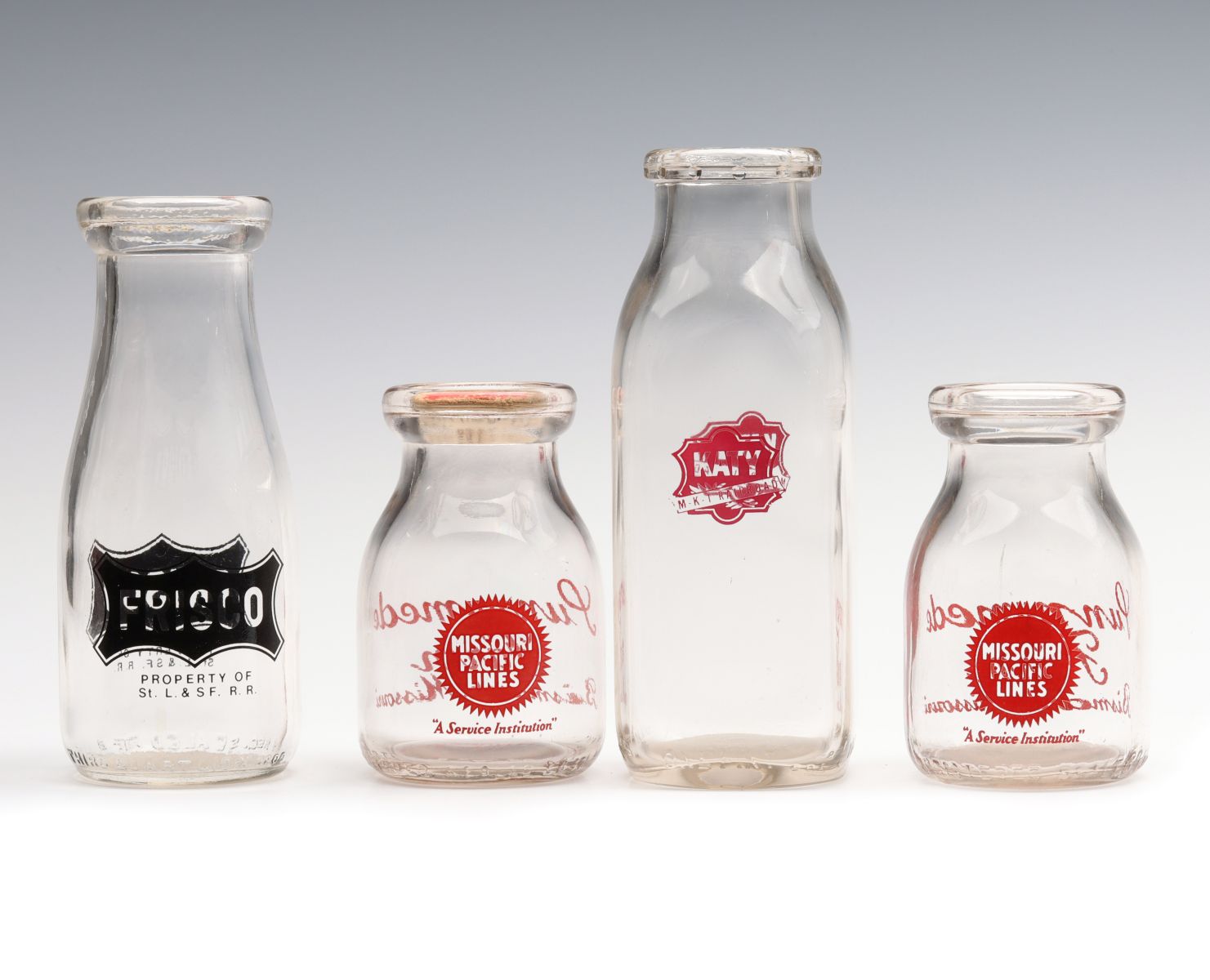 VINTAGE MILK AND CREAM BOTTLES WITH PAINTED RR LOGOS