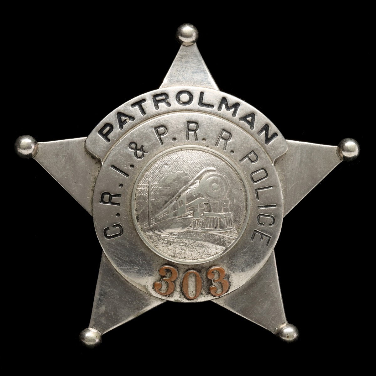 A FIVE POINT BALL-TIP ROCK ISLAND RAILROAD POLICE BADGE
