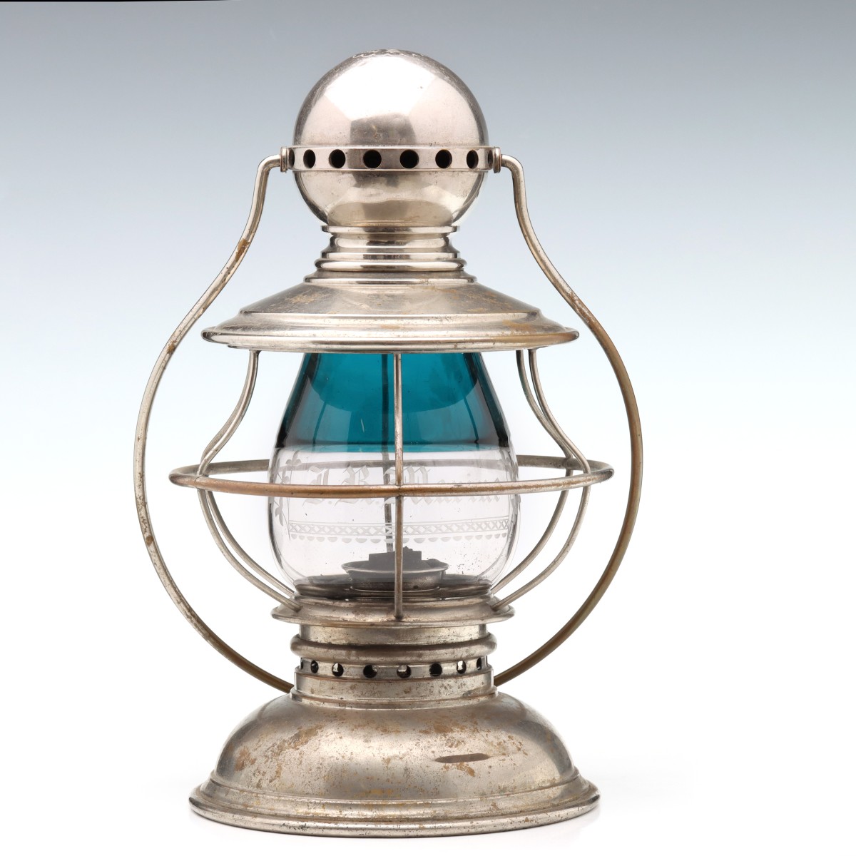 A PRESENTATION LANTERN WITH TEAL BLUE OVER CLEAR GLOBE