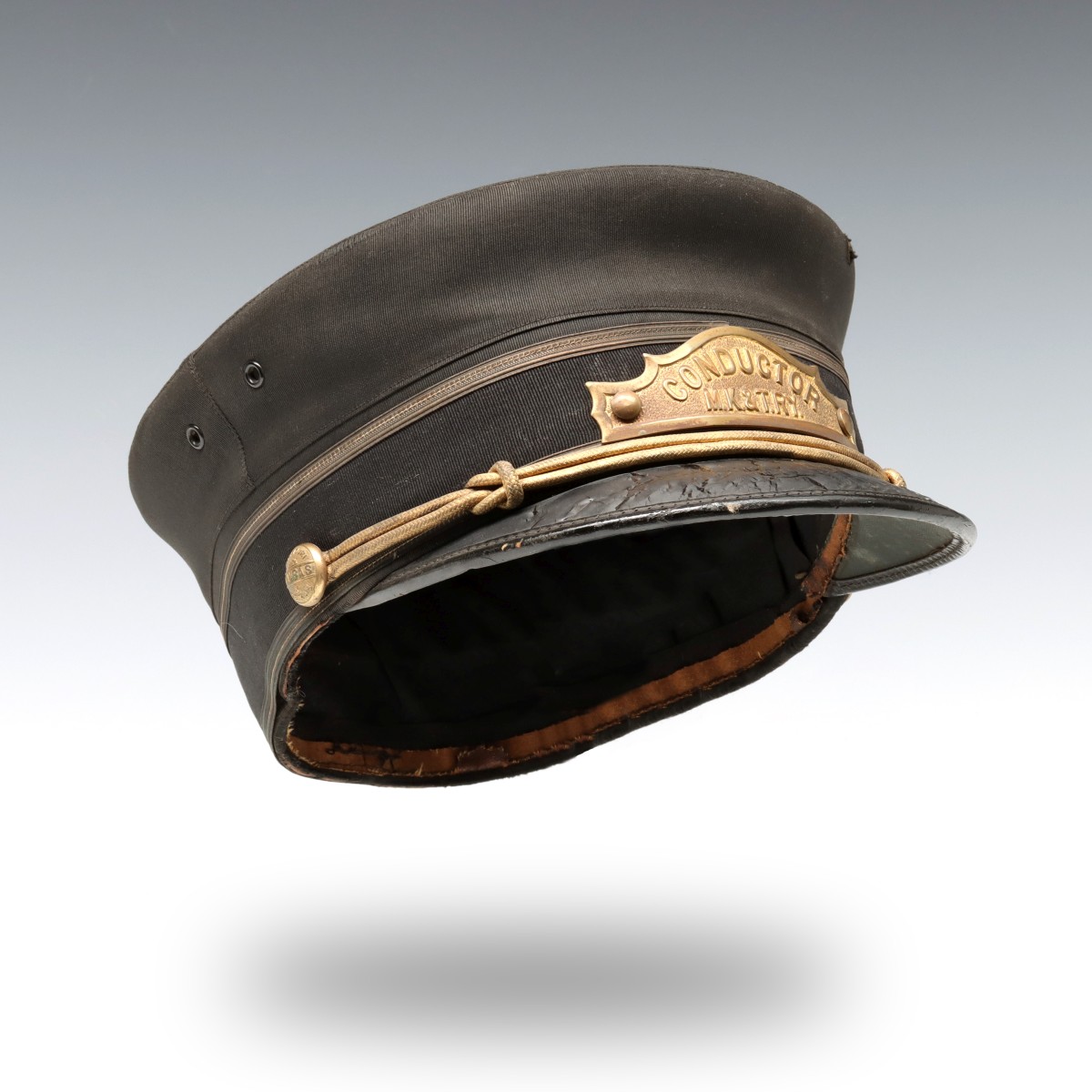 AN EARLY 20TH C. CONDUCTOR'S VISOR CAP FOR M. K. & T RY