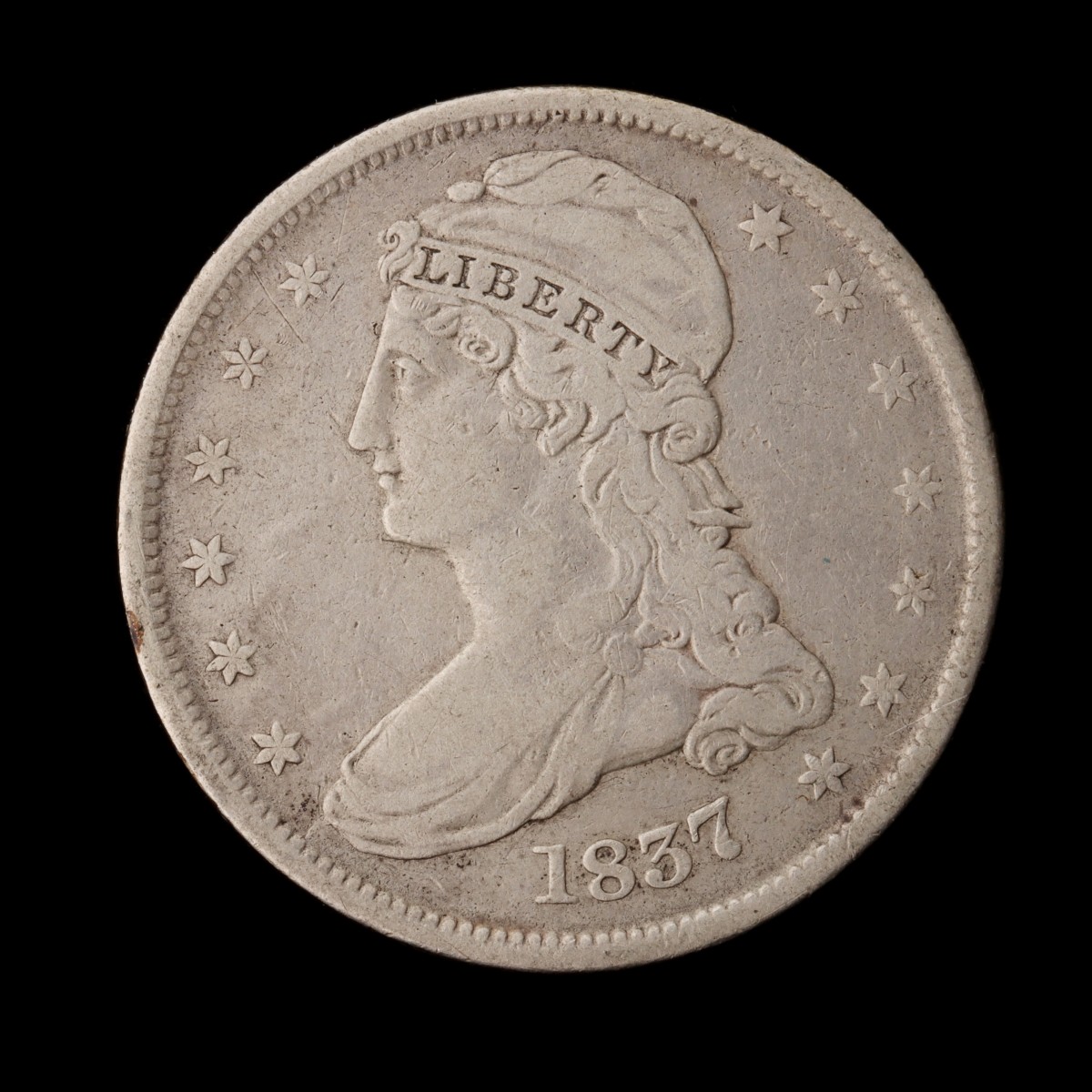 AN 1837 CAPPED BUST HALF DOLLAR
