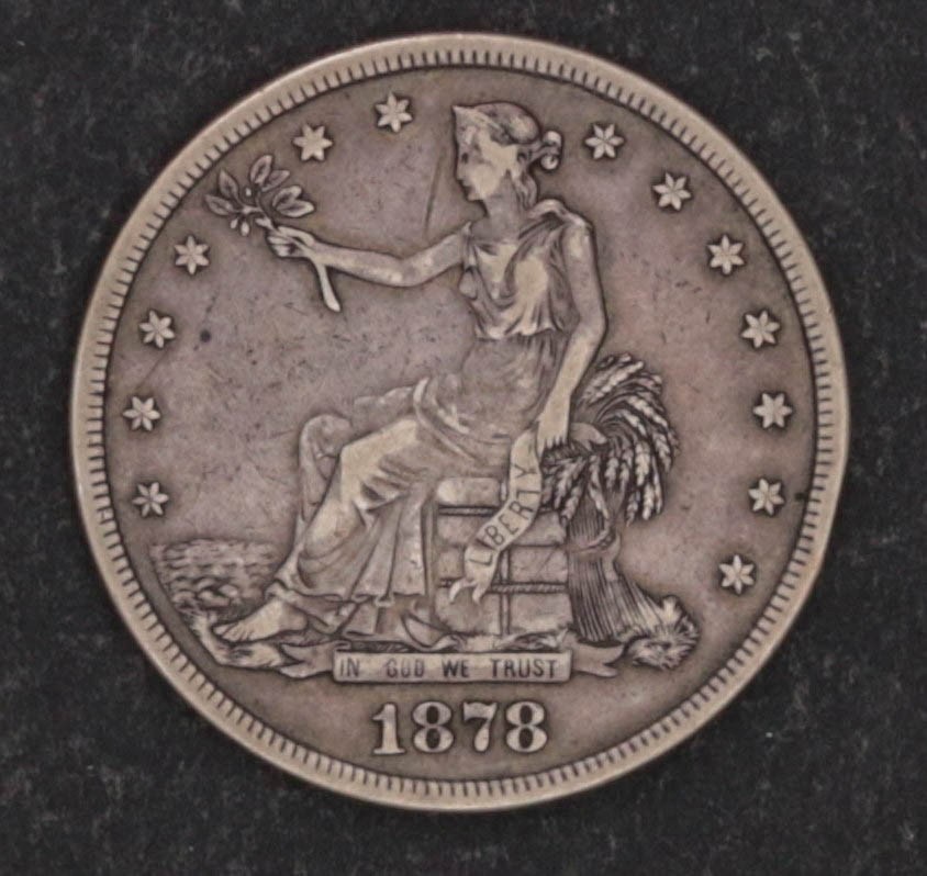 AN 1878-S SILVER TRADE DOLLAR