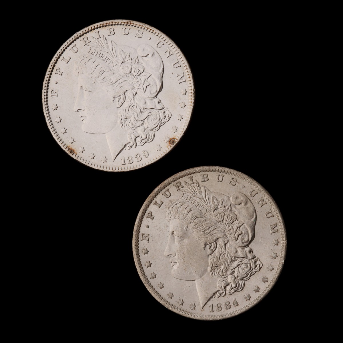 TWO HIGHER GRADE MORGAN SILVER DOLLARS, 1884-O AND 1889