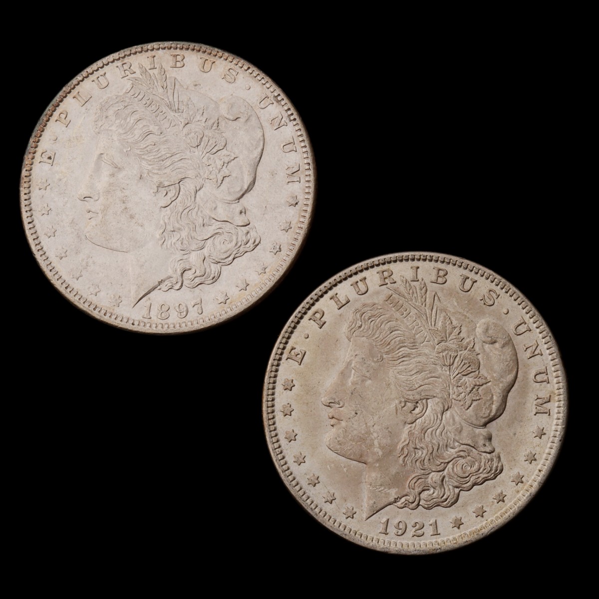 TWO HIGHER GRADE MORGAN SILVER DOLLARS, 1897 AND 1921