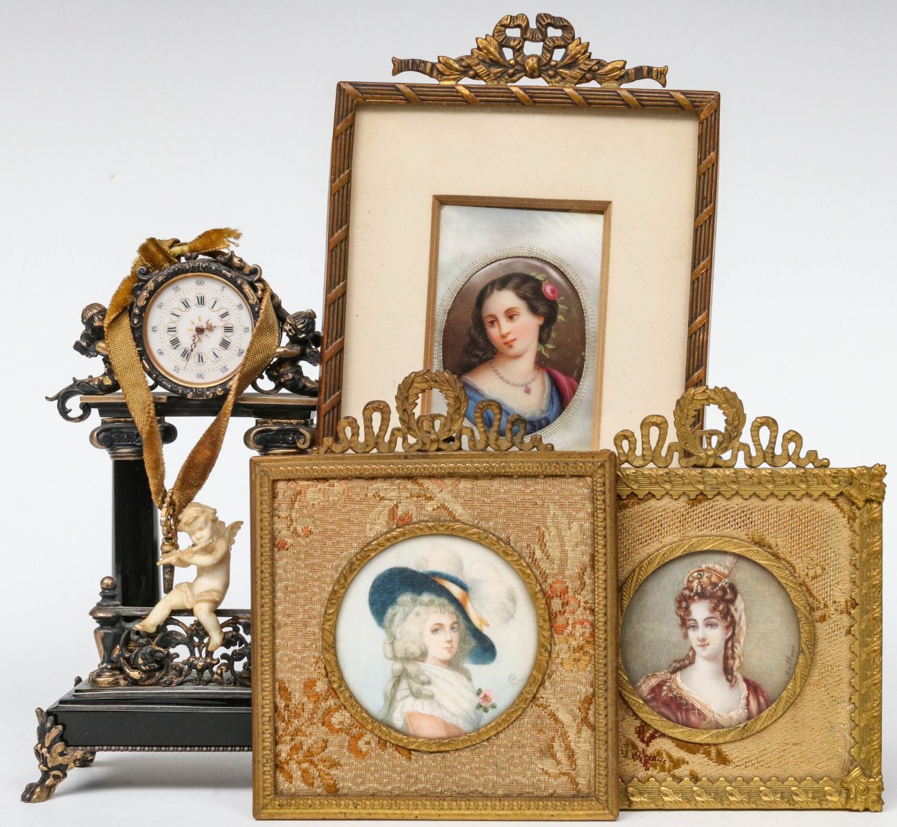 AN 800 SILVER CLOCK OFFERED WITH MINIATURE PORTRAITS