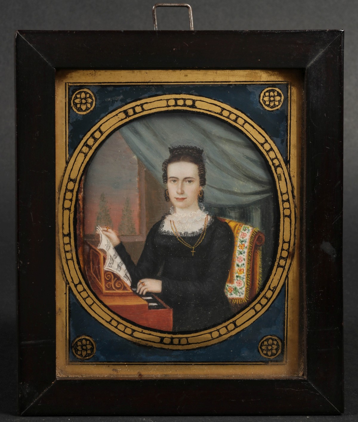 A 19TH C. MINIATURE PORTRAIT OF A WOMAN AT REED ORGAN