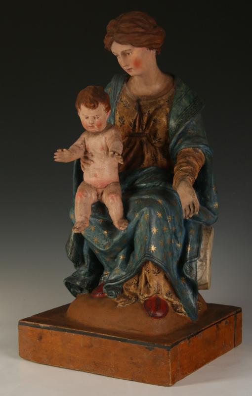 A CARVED WOOD SCULPTURE OF THE MADONNA WITH CHRIST CHILD 