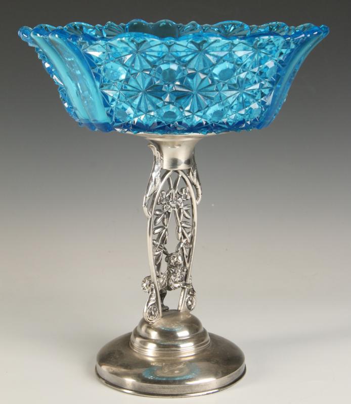 A BLUE DAISY AND BUTTON BOWL ON SILVER STAND WITH DOG