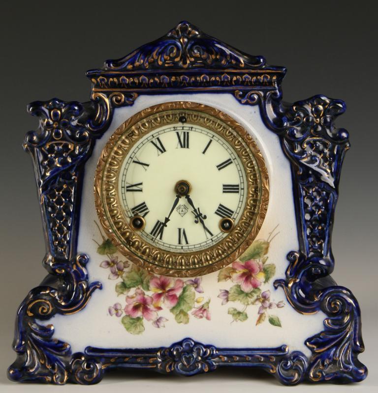 AN ANSONIA 'WHIG' PATTERN CHINA CASE CLOCK 