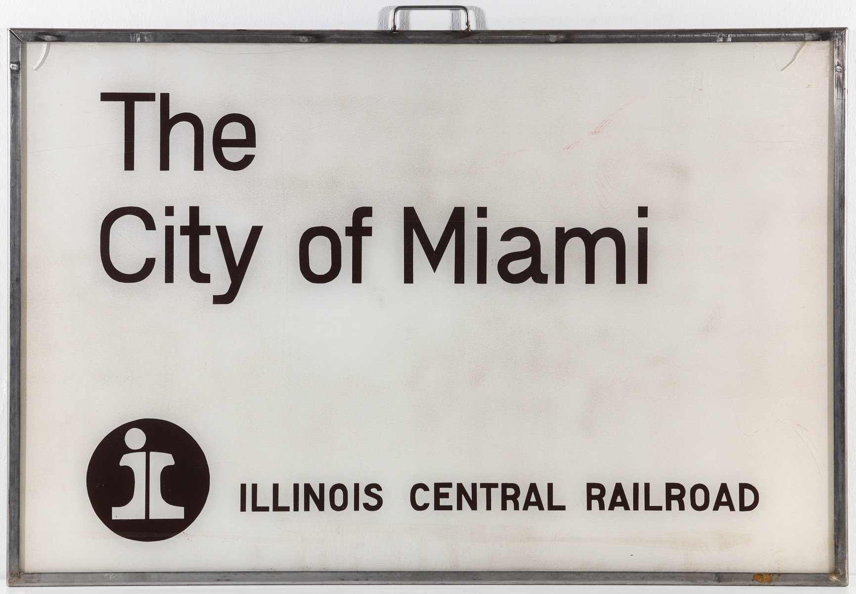 AN ACRYLIC SIGN FOR ILLINOIS CENTRAL 'CITY OF MIAMI'