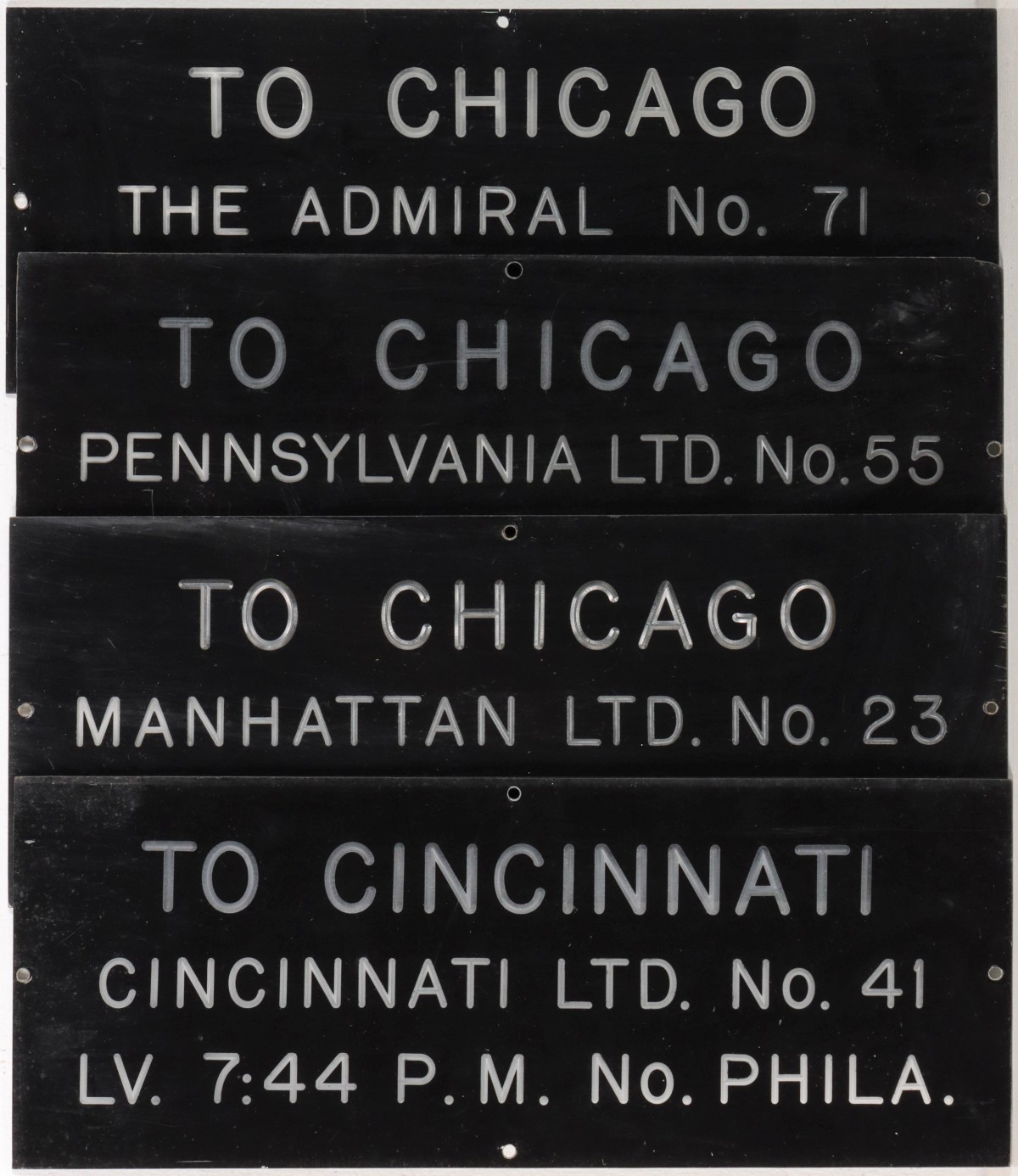 FOUR ENGRAVED LETTER ACRYLIC TRAIN STATION SIGNS