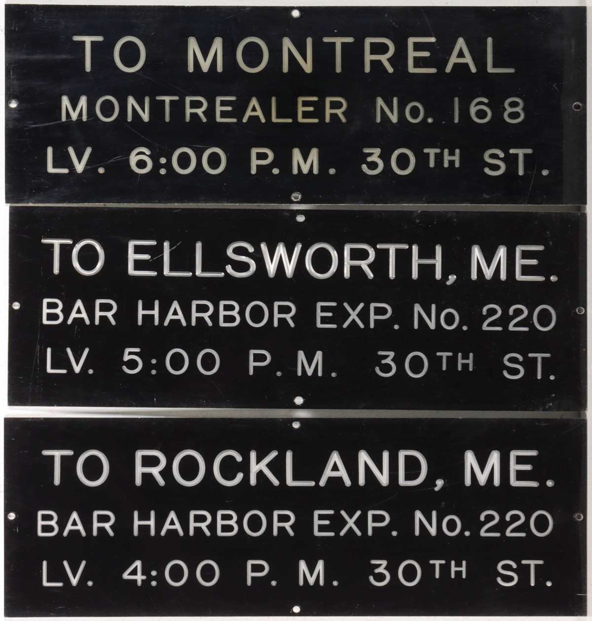 THREE ENGRAVED LETTER ACRYLIC TRAIN STATION SIGNS