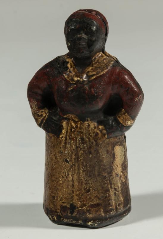 A PAINTED CAST IRON MAMMY FIGURE