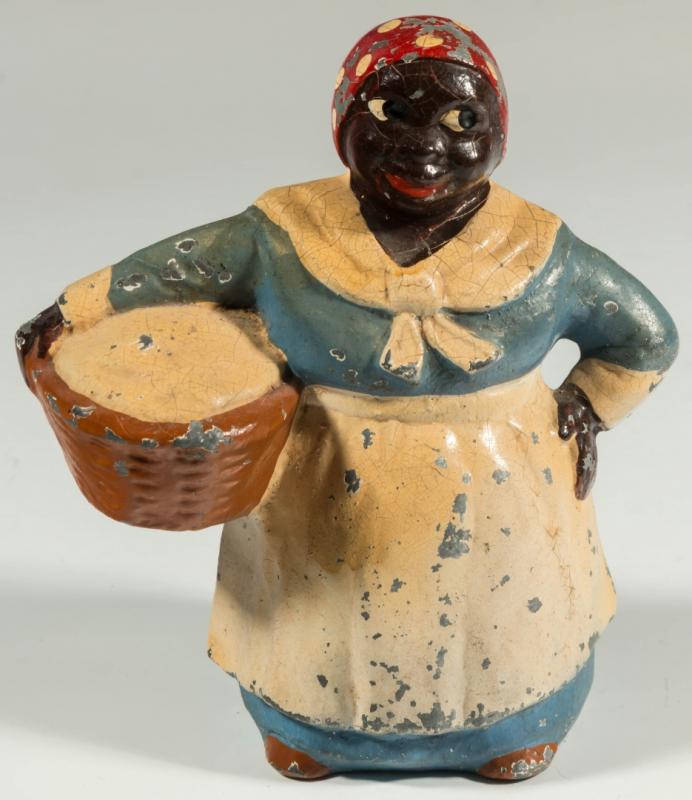 A SCARCE, ORIGINAL MAMMY WITH BASKET FIGURAL BANK 