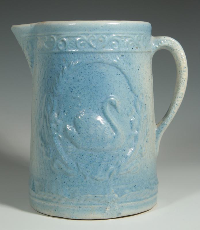 AN ANTIQUE BLUE AND WHITE PITCHER WITH SWAN