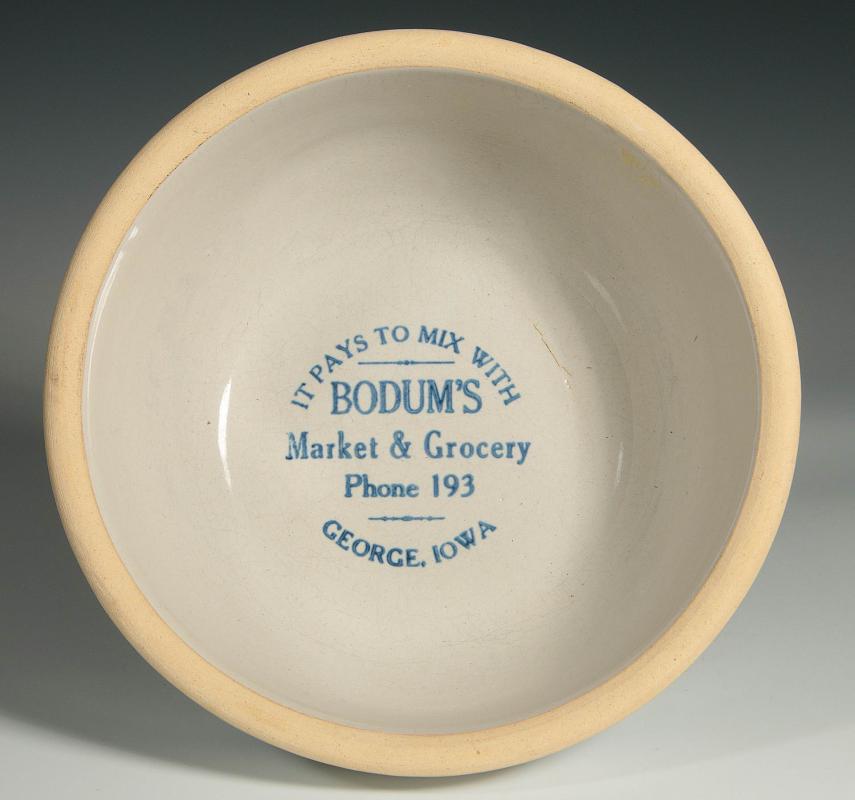 AN ANTIQUE STONEWARE BOWL WITH ADVERTISING