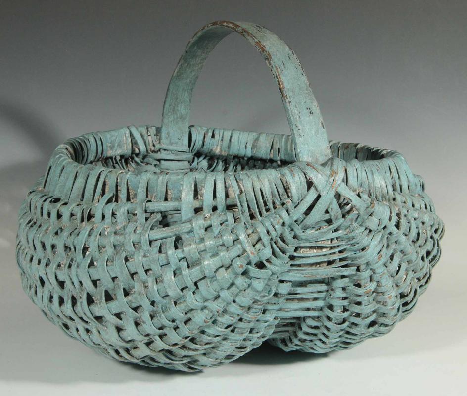 A GOOD ANTIQUE BUTTOCKS BASKET IN OLD BLUE PAINT