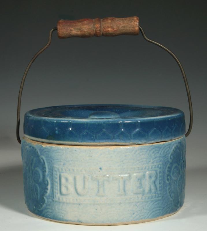 A BLUE AND WHITE STONEWARE BUTTER CROCK