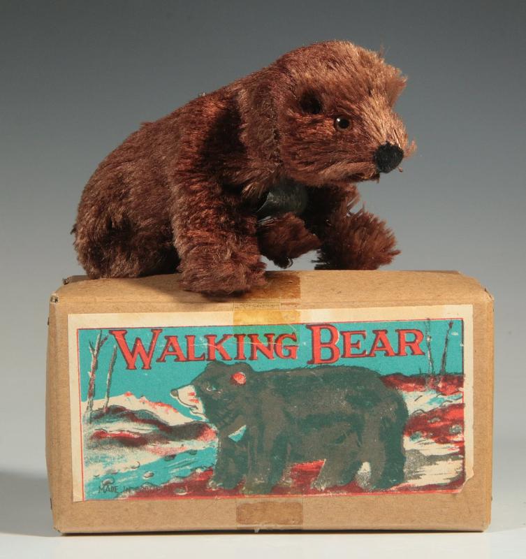 A VINTAGE PLUSH COVERED WIND UP 'WALKING BEAR' TOY