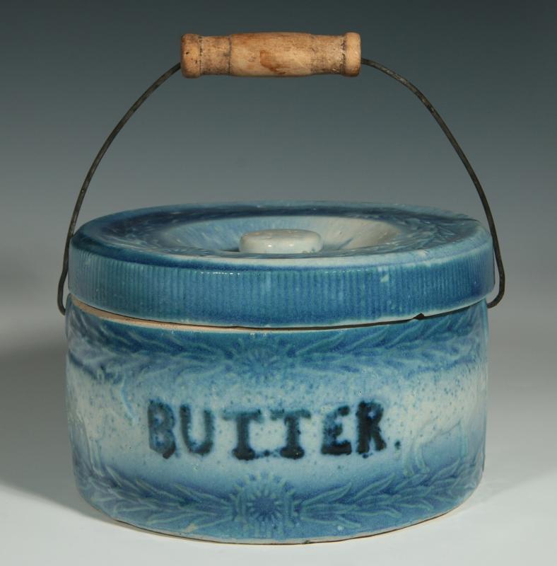 AN ANTIQUE BLUE AND WHITE BUTTER CROCK