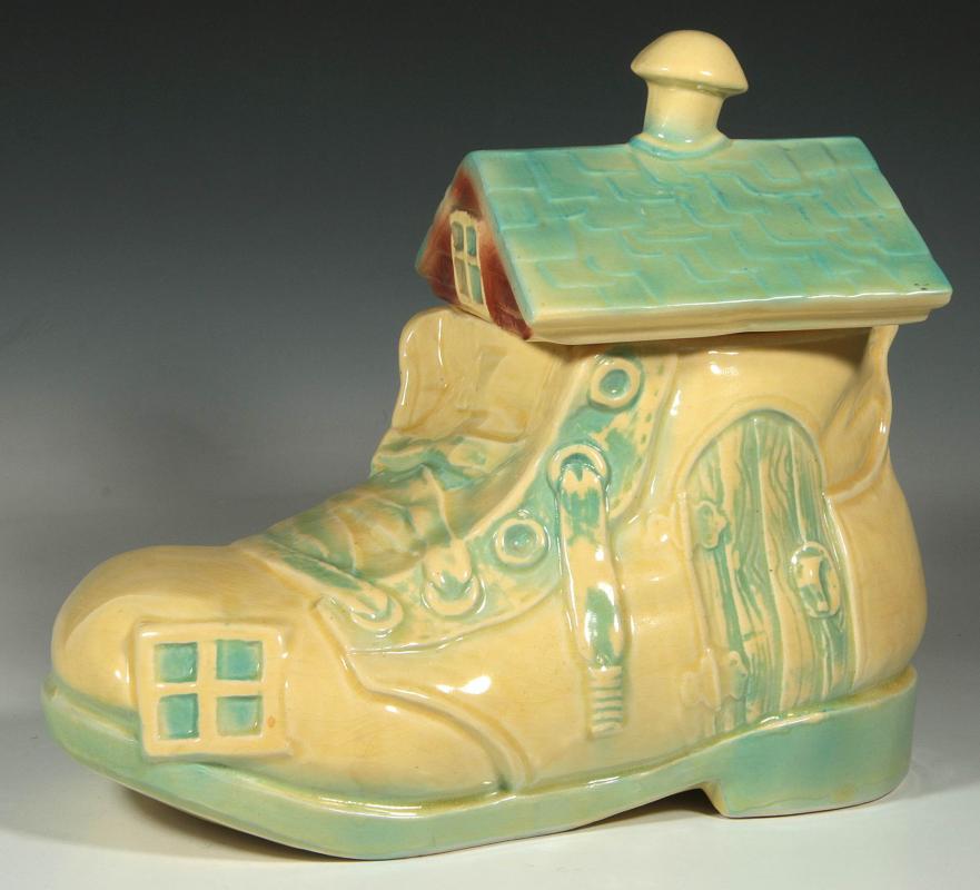 A BRUSH POTTERY 'OLD WOMAN IN THE SHOE' COOKIE JAR