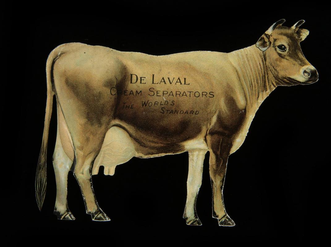 A DE LAVAL ADVERTISING TIN LITHO COW FIGURE